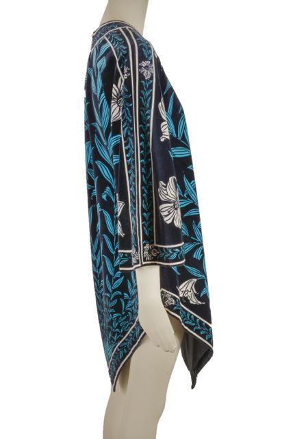 This vintage piece from Pucci is presented in a blue and white floral print on black velvet.  It is lined, features angel wing sleeves and points in the front and back.  The back closes with eye hooks and has a bit of a peek-a-boo. This is in mint