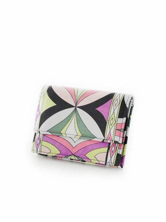 Vintage Emilio Pucci wallet in green, lime green, white, black, pink, light pink, purple and grey signed leather print. Wallet features one outside pocket and one inside pocket. Wallet is fully lined in black nylon and purple leather that is