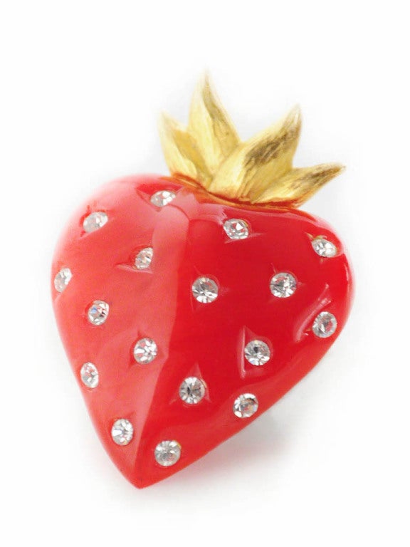 Vintage Givenchy strawberry pin made of red Bakelite, gold metal and sixteen rhinestones. 

Measurements-

Height: 2.25