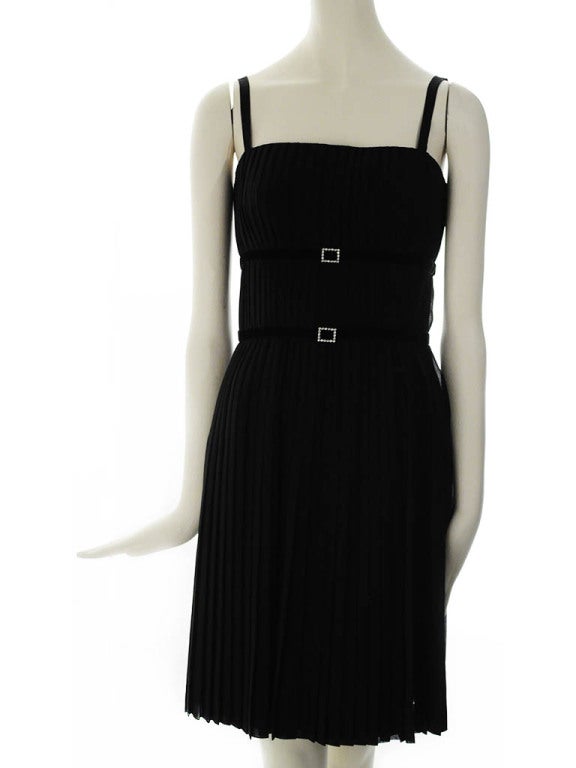 Vintage A-K-R-I-S pleated black silk chiffon cocktail dress. Dress features velvet ribbon band at waist and under bust with square rhinestone accent and invisible side zipper with snap and hook and eye closures. Dress is fully lined and has boning