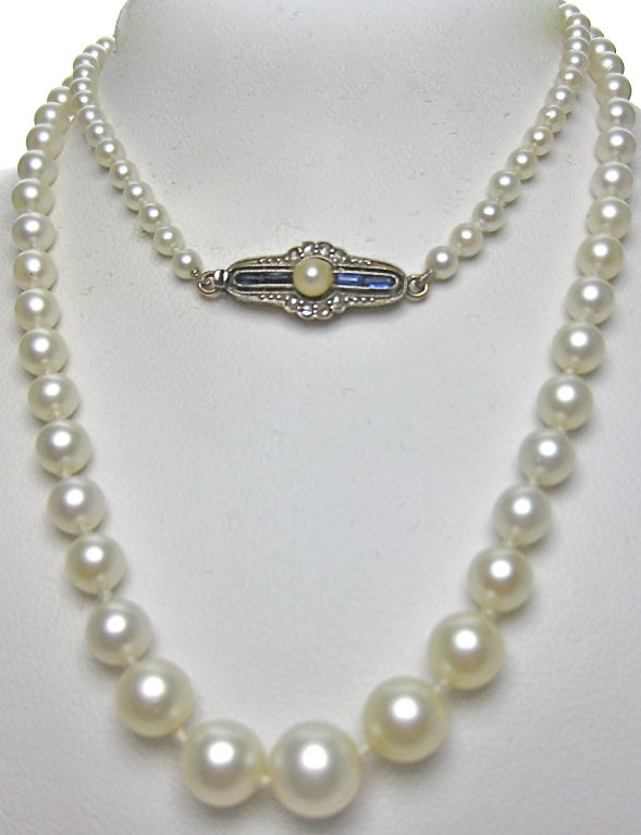 There are 101 saltwater cultured white pearls that are graduated and measuring 8mm to 3mm.  The pearls  are blemish-free and very well matched.  The necklace is matinee length measuring 25.1/2 cms long with the total weight of 13.9 grams. The