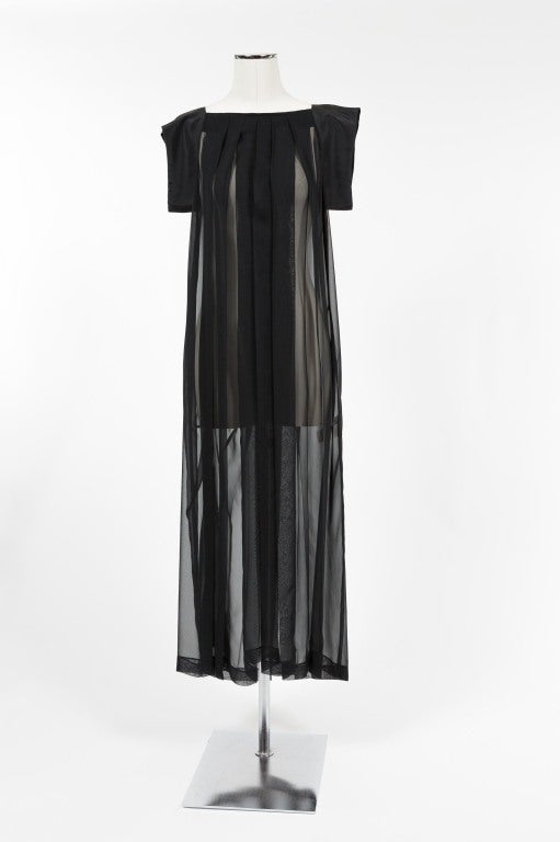 Fabulous signature black Yohji Yamamoto dress with squared neckline that dusts the collarbone; five soft center pleats drape from collarbone to hem; 2