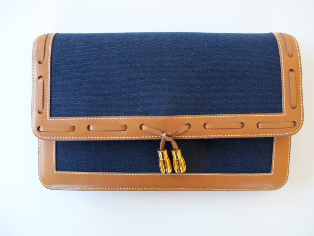 New - never worn - navy blue silk canvas with camel leather border with stitching and removable shoulder strap. Front interior partition.

Photography provided by Roberto Rosas-Mariscal for Helpers House of Couture.