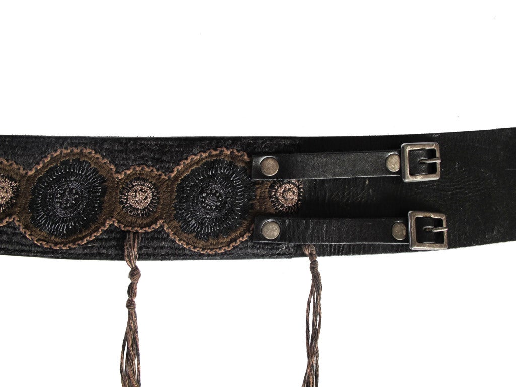 Boho-style black leather and applied embroidery wide belt fastened with two straps and buckles; embroidered 