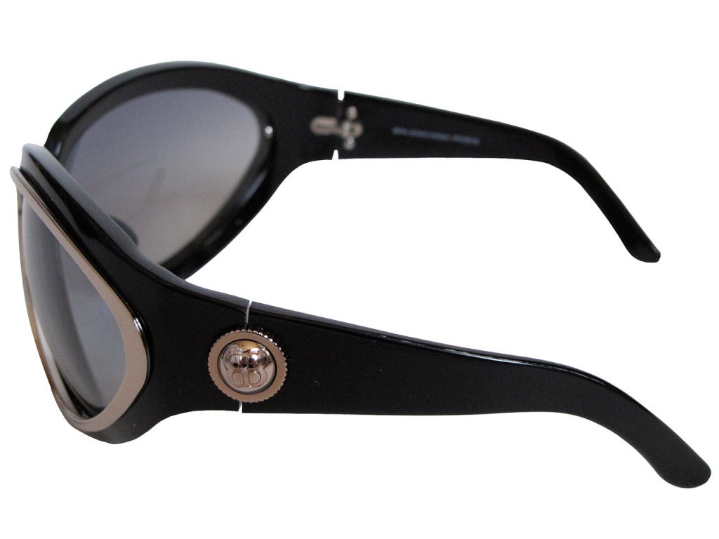 Balenciaga Paris "Spy" sunglasses with rose gold and silver tone hardware at earpiece hinges. Model 0002/S 807VK 85. These glasses are from 2007 “Tron” Collection and this model is called “Spy”. The outline of the glasses is