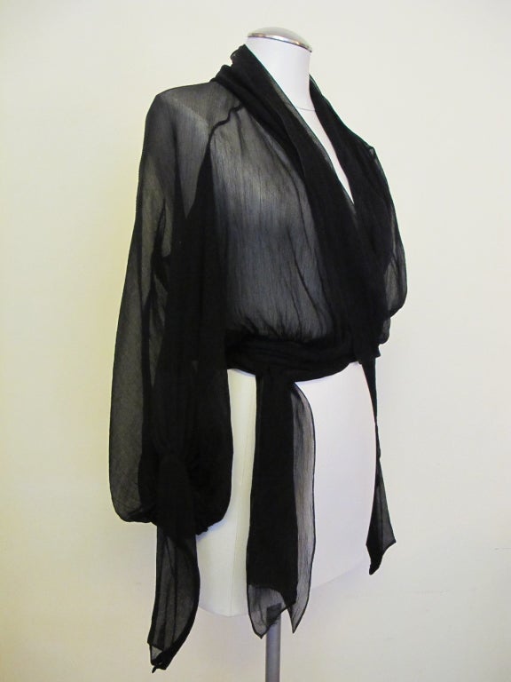Elegant timeless wrap around blouse with 8 inch cuff with zipper. Raglan sleeve. This piece is exquisite - Era of Gaultier at Hermes. Size 34 (2-4)