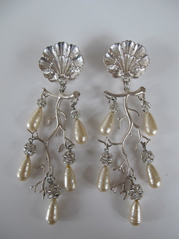 Dramatic statement, clip backed earrings with fabulous shell design and a cascading branch with rhinestone rondelles and elongated faux pearls; fabulous fancy earrings.
