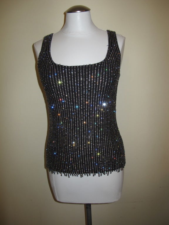Exquisite, glamourous sleeveless, tank top with cascading vertical strips of rhinestones, stretch fabric. Original price $2,400.00
Shipping $20 USA - Alaska & Hawaii price to be determined