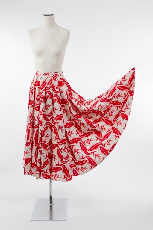 Unique vintage Carlos Falchi full linen skirt with lovely red fish design on white background. Waistband fastens with a side button and zipper; unlined.

Photography provided by Drew Altizer Photography for Helpers House of Couture.
