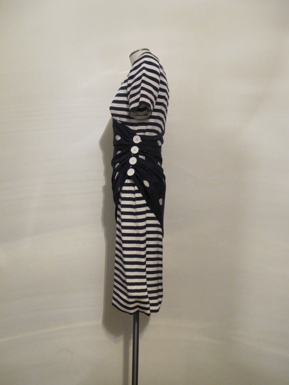 Stunning navy and white striped day to evening Bill Blass dress with draped polka dot overlay, fastened with 4 white buttons. Made of heavy silk with full lining. Buttons coincide with size of polka dots. Short sleeve length 8.75 inches, shoulder to