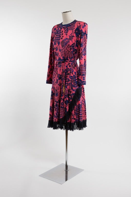 Floral print dress with pleated navy blue silk chiffon asymmetrical ruffle at hem. Gorgeous shocking pink and indigo blue colors.

Photography provided by Drew Altizer Photography for Helpers House of Couture