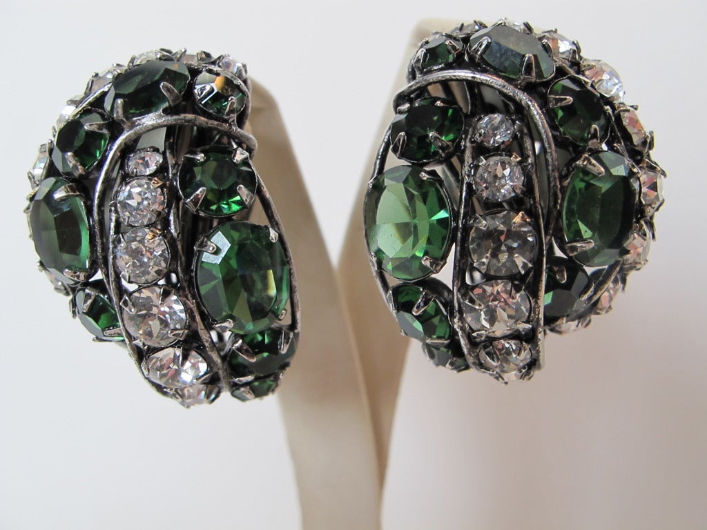 These statement earrings are collectable. They are gorgeous in tones of green and rhinestones. Earrings wrap around ear. Faceted gemstones - clip on backs.