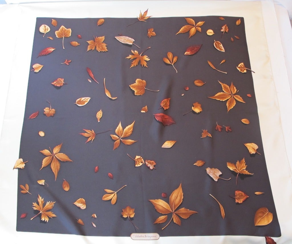 Exquisite magical design of leaves that seem to be real and fall into a chocolate brown background with light cream border.

Hand rolled and hand stitched hem. Original folds.