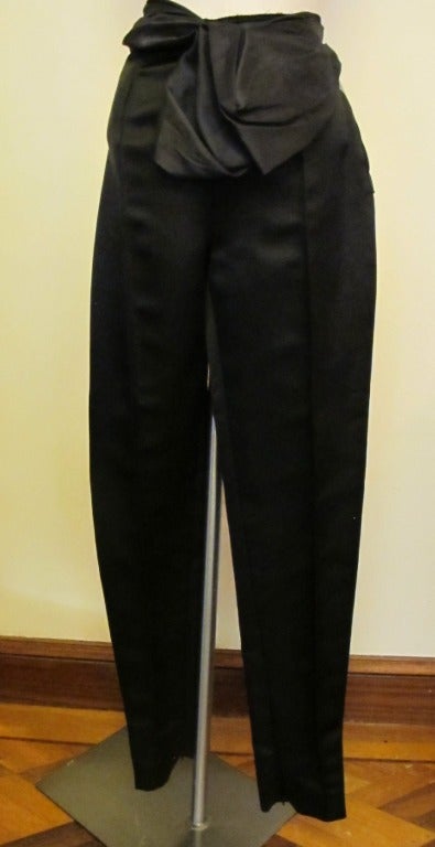 Luscious Lanvin silk satin pants with raw edge waist and 7 inch zipper exposed. Silk taffeta forms a drape at waistline. Inside seam measures 34 inches.