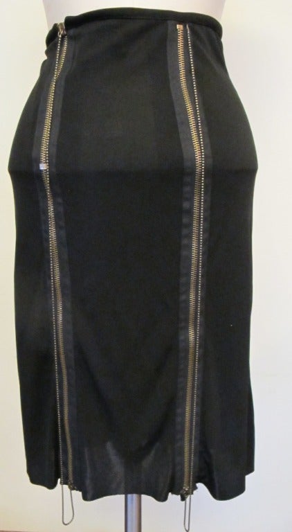Chic Skirt with three panels on each side attached with zippers and moveable ball chains. It is a statement piece.