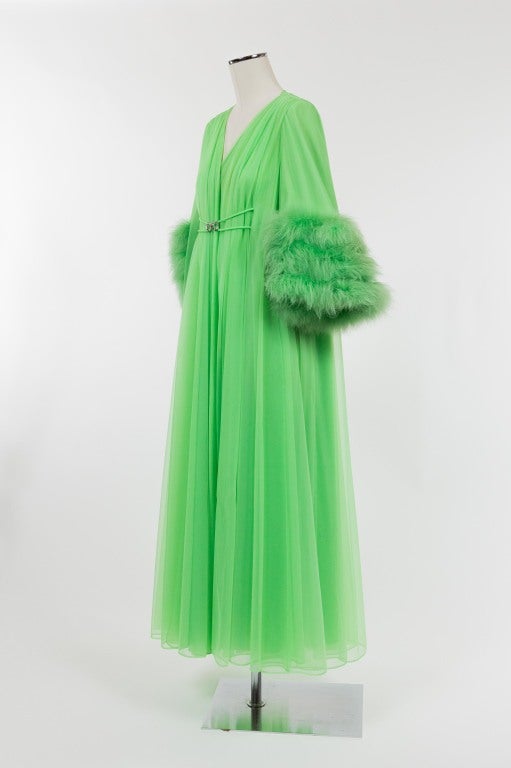 Three rows of marabou trim this glamorous dressing gown. Marquis shaped diamond buckle secures coat in front; front panels are lightly gathered at shoulders with goddess-like flow to the floor. A must have for any femme fatale!

Photography