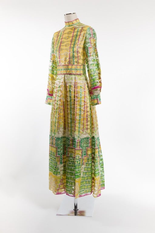 Colorful Bollywood-inspired evening dress with sherbet tones of yellow, green and fuchsia. Highlighted in gold metallic thread retro design and comes with adjustable belt. Lined in silk, fits size 2-4.

Photography provided by Drew Altizer