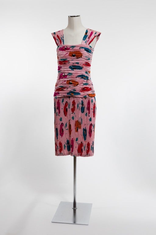 Wow them in this wildly feminine print on print silk dress. Light pattern-infused soft pink background with dramatic splashes of magenta, turquoise, teal,red, black and burnt orange. Accordion pleated wide straps over a vertically-oriented accordion