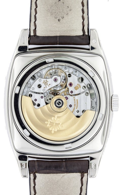 Patek Philippe cushion-shaped 18k white gold wristwatch, Ref. 5135G, with original strap and 18k white gold buckle, sapphire case back, case dimensions 51mm, including lugs x 40mm. Self-winding movement with Annual Calendar mechanism, day, date, and