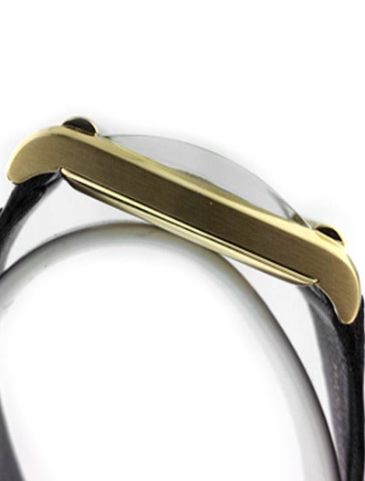 Patek Philippe 18k yellow gold rectangular wristwatch, circa 1940s, on non-original croc strap. Slightly hooded lugs, domed mineral crystal, case dimensions 39mm (incl. lugs) x 24mm, manually wound movement, sub-seconds. Silvered dial with applied