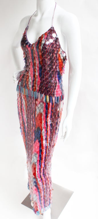 Missoni halter and skirt adorned with multicolored paillettes and fringed hem. Skirt sits low on the waist and features a fringed slit up the side. Both top and bottom zipper up the side. Fabric 98% polyester and 2% elastane. Sizing tag: