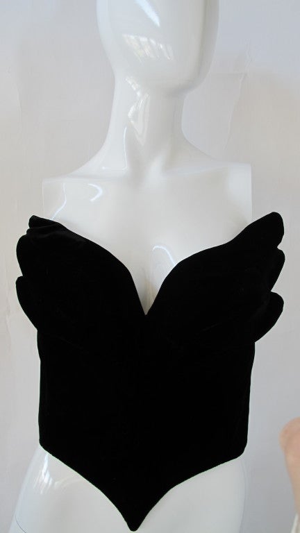 A Thierry Mugler black velvet concept bustier in the shape of angel wings. Constructed from bendable wire sewn into the fabric interior, the angel wings are sewn into the bustier front and give the illusion of 