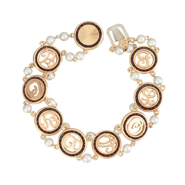 A Vintage Gold, Garnet and Pearl "I Love You" Bracelet