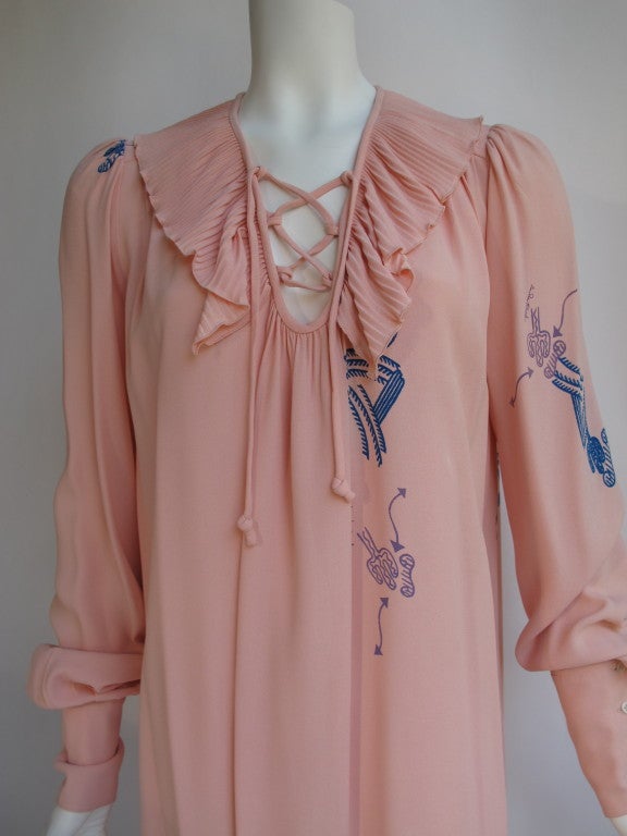 Vintage Zandra Rhodes pink rayon shirt dress featuring a romantic, oversized pleated  and lace-up collar. Sleeves are extra long and be worn long or for a billowing effect, can be buttoned at the wrist. The print is a Zandra Rhodes classic - a
