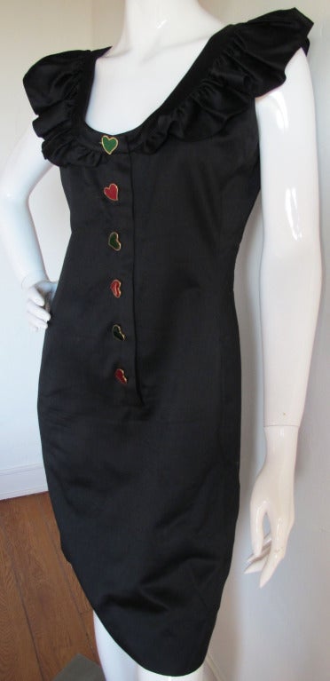 1990's Yves St. Laurent cotton and silk blend fitted day dress with ruffle detail along the scooped neckline. Enameled green and red heart buttons run down the front of the dress. Please consult measurements as there is no sizing tag. About a US