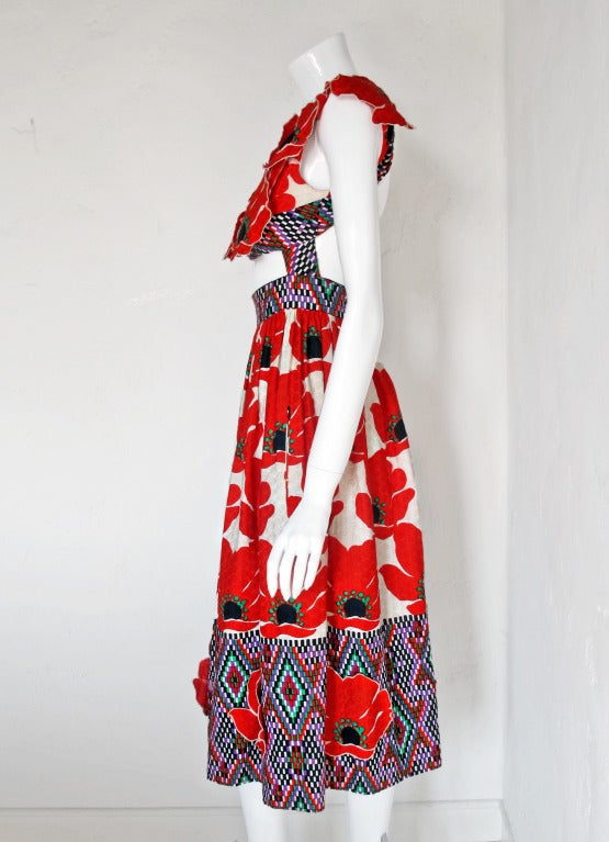 This might be the best Donald Brooks dress I've ever seen and that's saying something - that guy designed some terrific dresses! The top is covered with applied/tacked red poppies as is the bottom of the skirt. Otherwise, the cotton fabric is a