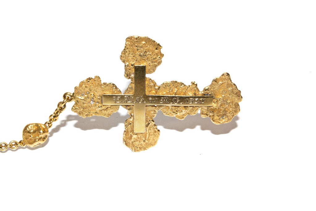 Comprising fifty nine gold nuggets and the Crucifix and Medal appear to be formed of hammered nuggets. The letters INRI are on a scroll above the head of Jesus and the reverse is engraved E L G to M G 1820. The country of origin is not clear but I