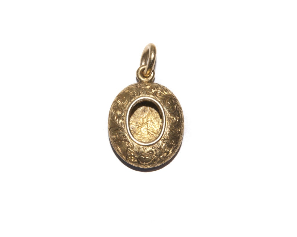 A Victorian Enamel Rose Diamond Gold Pendant Locket