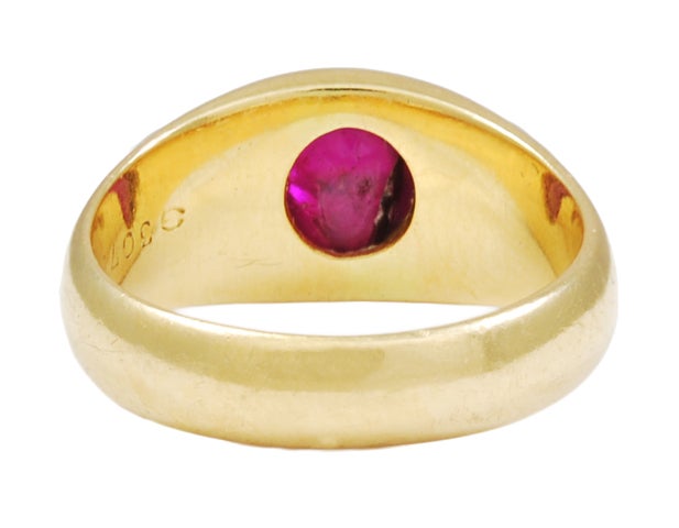 A SINGLE STONE GYPSY SET CABOCHON RUBY AND GOLD RING
These were often worn in multiples, such as emerald and sapphire.