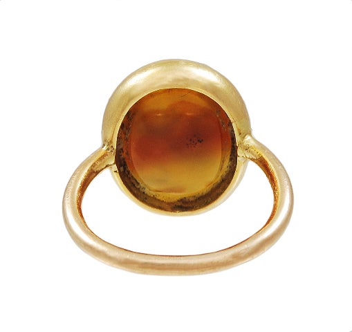 A CARVED BROWN CARNELIAN INTAGLIO OF SOCRATES, THE GREEK PHILOSOPHER MUCH ADMIRED BY THE ROMANS, MOUNTED IN A SLENDER GOLD RING MOUNT, FRENCH CIRCA 1820