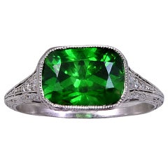 A DEMANTOID GARNET & DIAMOND RING