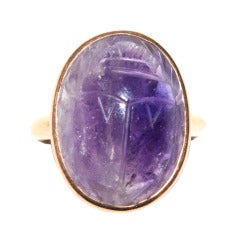 An Egyptian Carved Amethyst Scarab in a Gold Ring Mount