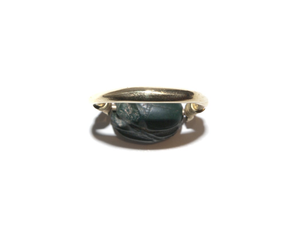 An Ancient Greenstone Scarab in a Gold Stirrup Ring Mount