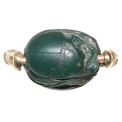 Antique An Ancient Greenstone Scarab in a Gold Stirrup Ring Mount