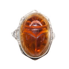An amber coloured carved Citrine Scarab Ring