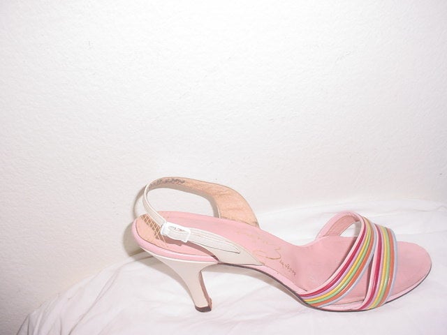 Vintage 50s shoes by shoe genius David Evins. Size 8 AA. 10 inches long. Ball of 3  1/4 inches. Heel of 3.5 inches. Evins started as a fashion illustrator at Vogue magazine.
Pink and pearlescent white with rainbow stripes.