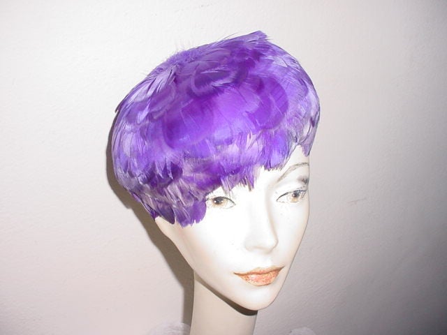 Vintage whimsical 50s feather wig style hat. On stretch mesh base.