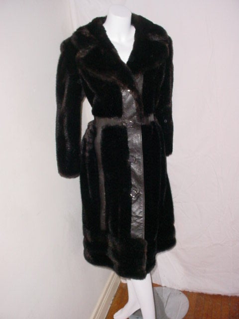Vintage 1970s faux fur coat made of Tissavel France fibers. Acrylic and cotton. Excellent condition. Size Medium. 40 inch bust 36 inch waist, 38 inch hips, 43 inches long. Faux fur with strips of very realistic faux 