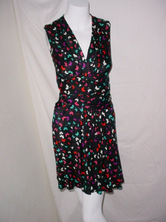 Beautiful dress in silk jersey by Issa of London. Butterfly print in black, pink, purple and turquoise. With sash that wraps and ties. US size 2, UK size 6. 36 inches long.