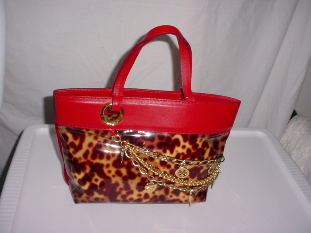 Roberto Cavalli red leather and faux tortoise bag. With draped golden chains with hearts and Italian horns. Excellent, unworn condition. Circa 2005