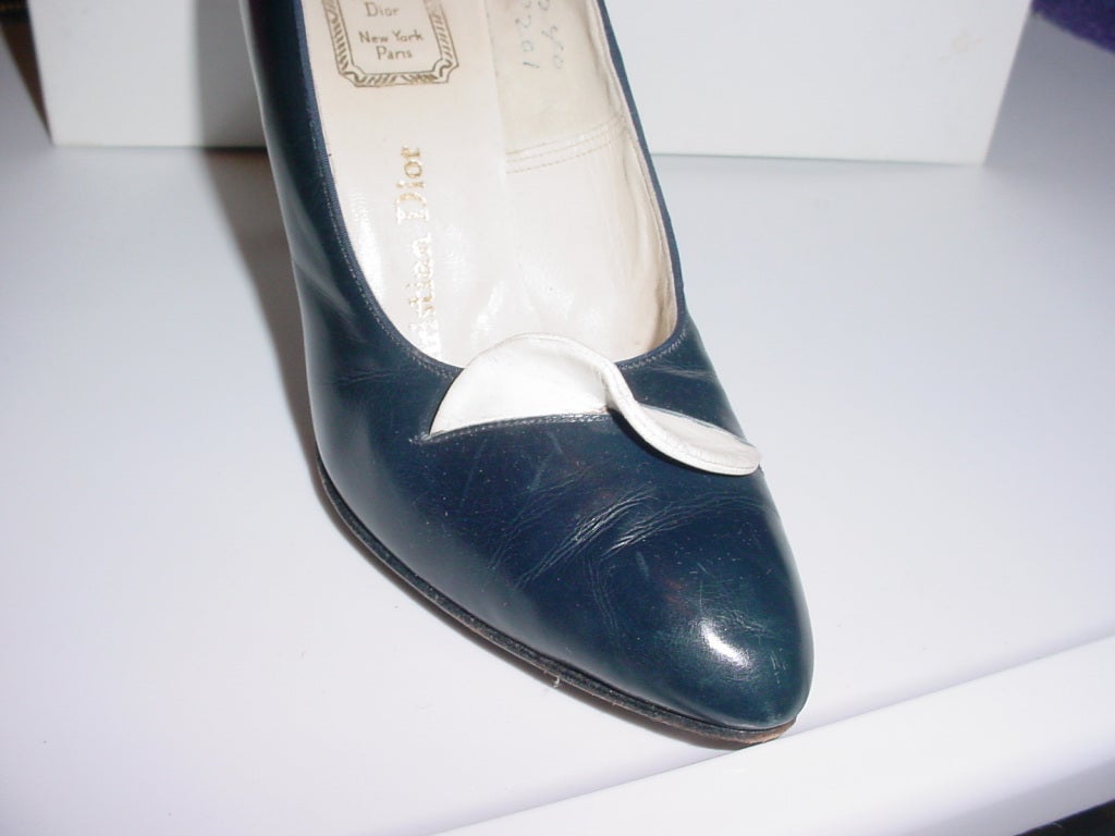 1950s navy and white shoes by Dior. Size 7 B. 3.5 inch heel, ball of 3 inches. 10 inches long. Navy with white avant-garde trim.
