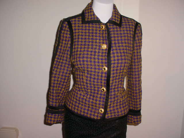 Vintage 1990s jacket by Versus by Gianni Versace. Brown and purple with black trim. Goldtone buttons. Wool, mohair and assorted other fibres. Excellent condition. Beautiful violet lining. Italian size 40. US size small.

bust 32 inches
waist 27