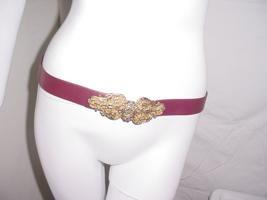 Vintage 80s belt from jewelry designer Gay Boyer. Excellent condition. Brown belt with elaborate Leiber style goldtone buckle.  1 1/4 inches wide, 34 inches long. Buckle is signed Gay Boyer.