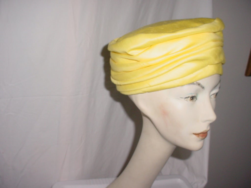 Vintage yellow hat by Schiaparelli. Classic 60s styling.