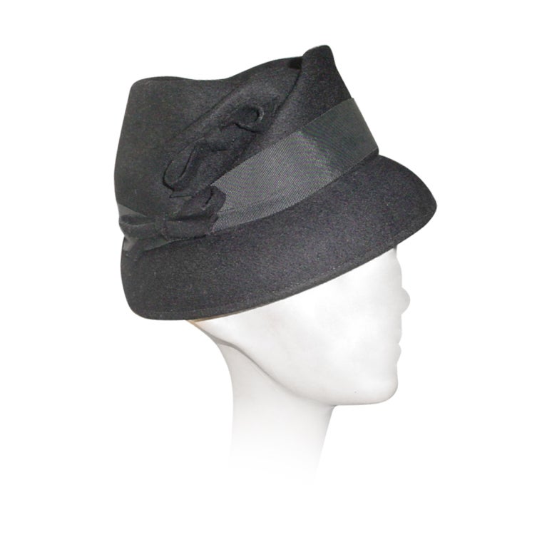 Vintage black 50s hat made of Glenover felt. With grosgrain ribbon and bow trim.
