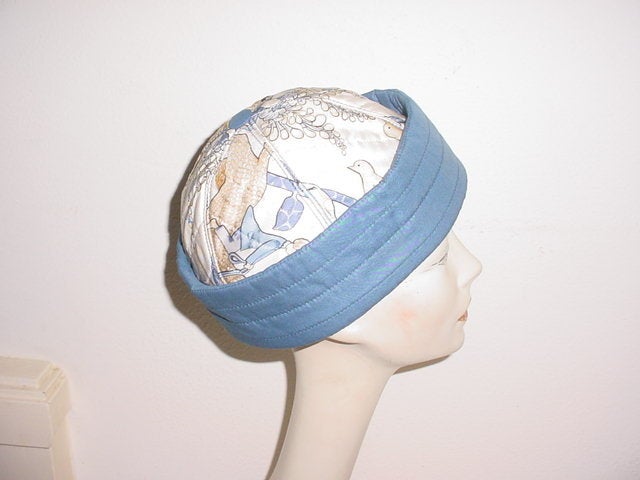 Vintage Hermes hat in silk twill in blues and browns. Excellent condition. Size small.